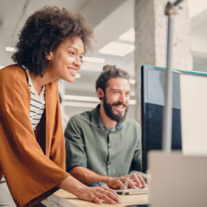 Legal recruiters reviewing candidate profiles together at a computer