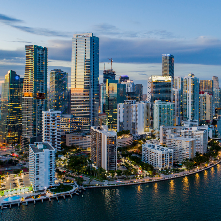 Vibrant skyline of Miami, FL with high-rise buildings and Biscayne Bay, highlighting staffing agency services in the area.